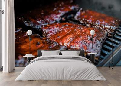 Smoked Barbecue BBQ ribs on the smoker grill charred on the edges and covered in barbecue sauce homemade Wall mural