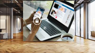 businesswoman working on his phone in the office, select the icon security on the virtual display.Business, technology, internet and networking concept.  Wall mural