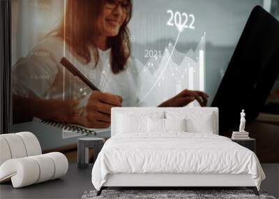 Concept of planning and strategy. Stock market. Business growth. progress or success idea A business woman or trader is showing a growing virtual hologram stock. Invest in trading in 2022 Wall mural