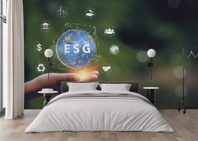 ESG Icon Concept In Hand for Environment, Society and Sustainable and Ethical Business Governance on Networking Wall mural