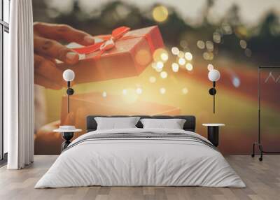 He opened a wonderful gift box for his lover.Concept merry christmas and happy new year  2023, 2024, 2025 Wall mural