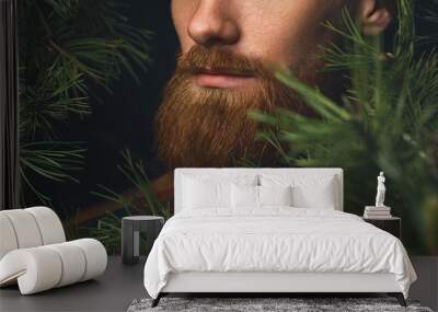 Close up shot of red beard. Hipster man in the forest. Brutal bearded man in the woods on a background of trees Bearded young man confident wide shot with copy free space on left Wall mural