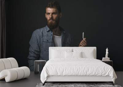 Portrait of bearded man with straight razor Wall mural