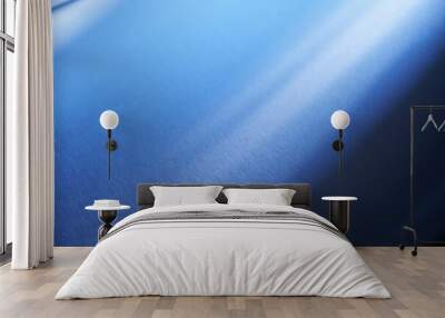 Stainless steel texture. Metal texture. Texture of stainless steel with an accent of light. A beam of light on a blue metallic background. Wall mural