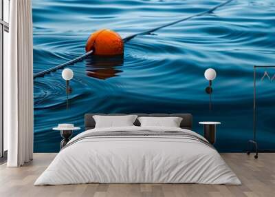 A close-up of marine cables and buoys floating on water, with gentle ripples creating texture. Wall mural