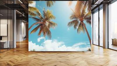 Blue sky and palm trees view from below, vintage style, tropical beach and summer background, travel concept Wall mural