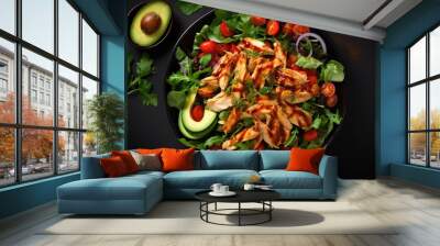 Mexican rotisserie chicken salad in black bowl on table, top view Wall mural