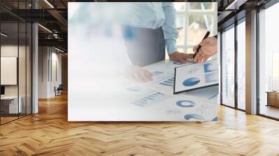 Businesspeople evaluate project efficiency and financial figures with business team for marketing research and business strategy plan. Wall mural