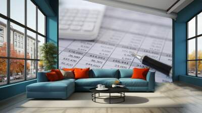 pen, calculator and business analysis report on desk of financial advisor. financial accounting concept. Wall mural