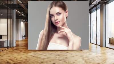 Beautiful long hair smooth woman with perfect hairstyle young model Wall mural