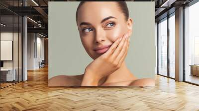 Beautiful woman face close up manicure nails hand touching skin  beauty make up natural healthy clean skin  Wall mural