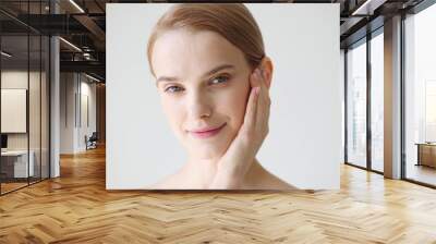 Beautiful woman healthy skin natural make up close up face beauty blonde short hair Wall mural