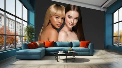 Ethnic beauty skin two women beauty face healthy skin and different colors african and caucasian Wall mural