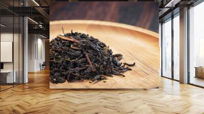 close-up of dry Chinese tea in wooden bowl, vintage tone, selective focus Wall mural