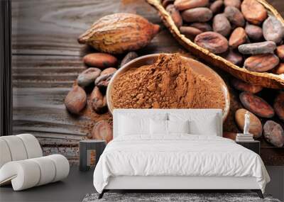 Cocoa powder and cocoa beans on wooden background Wall mural