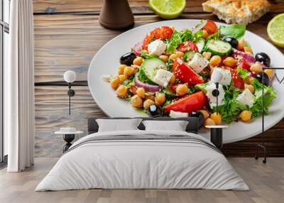 Greek salad with chickpea on wooden background Wall mural