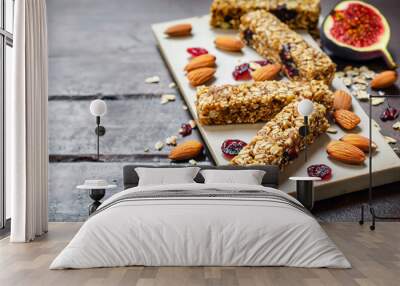 Homemade granola energy bars with figs, oatmeal, almond, dry cranberry, chia and sunflower seeds, healthy snack Wall mural