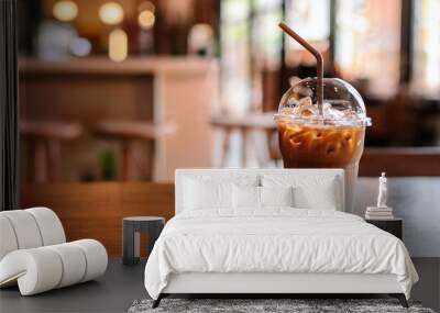 Iced latte coffee, placed on a table in a cafe. Wall mural