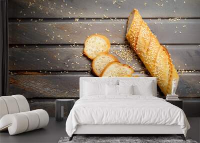 Slices of fresh crispy baguette with sesame. Top view Wall mural