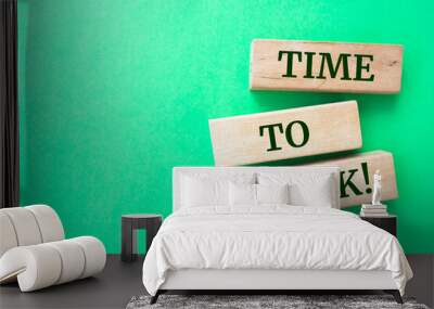 Time to risk words on wooden blocks on green background. Wall mural