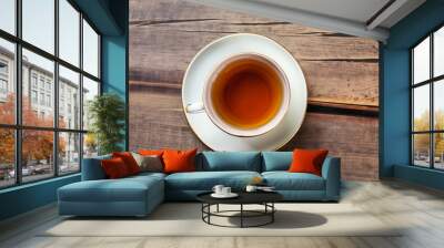 Top view of cup of tea on vintage wooden background. Wall mural