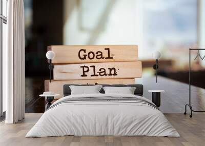 Wooden blocks with words 'Goal Plan Action'. Wall mural