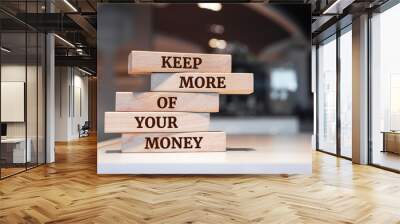 Wooden blocks with words 'Keep More Of Your Money'. Wall mural