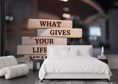 Wooden blocks with words 'What gives your life meaning question'. Wall mural