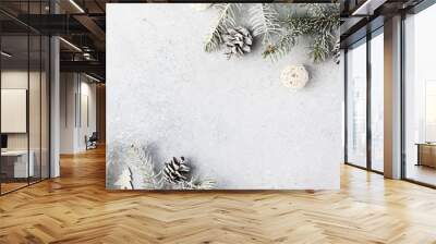 Christmas composition. Christmas fir tree branches, gifts, pine cones on wooden white rustic background. Flat lay, top view. Copy space. Banner backdrop Wall mural