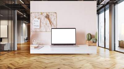 laptop with blank white screen on office desk interior. stylish gold workplace mockup table view. Wall mural