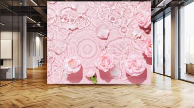 Top view of pink transparent clear calm water surface. Texture with splashes and bubbles and podium for cosmetics product. Trendy abstract summer nature cosmetic background Wall mural