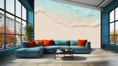 Tropical beach background with sea waves, white sand and foam - summer holiday panoramic top view background. Travel and beach vacation, copy space for text. Wall mural