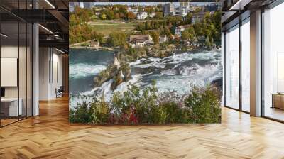 Powerful white rapids of the Rhine River at the Rhine Falls, the famous and largest waterfall in Europe located in Schaffhausen, Switzerland Wall mural