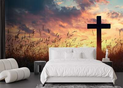 concept conceptual black cross religion symbol silhouette in grass over sunset or sunrise sky, Wall mural