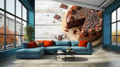 Sliced tasty chocolate cake on light wooden table background, copy space for text Wall mural