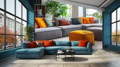 Spacious modern lounge with grey sofa and colorful pillows and poufs  Wall mural