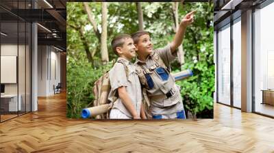  two excited boys on a camping trip in the forest exploring Wall mural