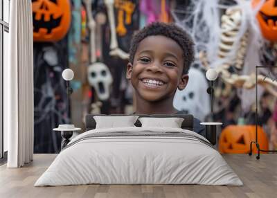 A young teenager black boy,he attends a Halloween party filled with surprises and spooky Halloween elements. clutching a bag of freshly won candy and looking forward  funny game or prank.  Wall mural