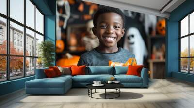 A young teenager black boy,he attends a Halloween party filled with surprises and spooky Halloween elements. clutching a bag of freshly won candy and looking forward  funny game or prank.  Wall mural