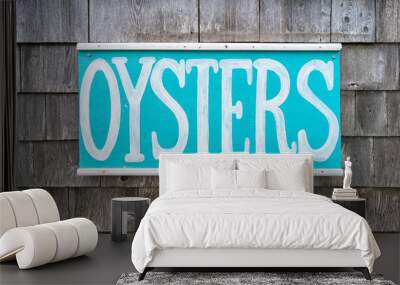 Rustic hand painted seafood sign on a wall of weathered shingles. Wall mural