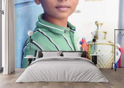 Indian school boy holding a golden trophy cup	
 Wall mural