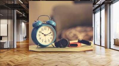 Retro alarm-clock with modern smart wrist watch Wall mural