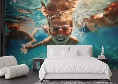 little boy and his family swim underwater in a swimming pool during summer vacation Wall mural