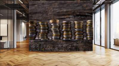 collection of colorful metal coins on wooden background, close view  Wall mural