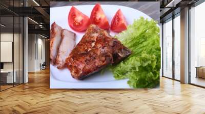 grilled pork chops with tomato, leaves lettuce and ketchup on plate. Wall mural