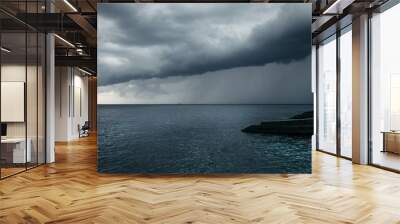 Dark blue sea storm, huge clouds and breakwaters. Wall mural