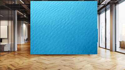 blue water background texture of sea surface top down view Natural color of ocean aqua with waves Backdrop for design Wall mural