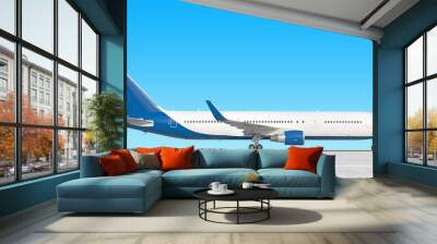 modern airplane side view isolated on airport runway background Passenger jet plane with gear down Commercial aircraft blue tail paint scheme Luxury business jet air travel Aviation design reference Wall mural