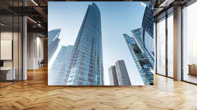 modern skyscraper building in city business downtown urban architecture landmark against blue sky background. Street ground wide view of abstract tower cityscape for backdrop. Futuristic skyscrapers Wall mural