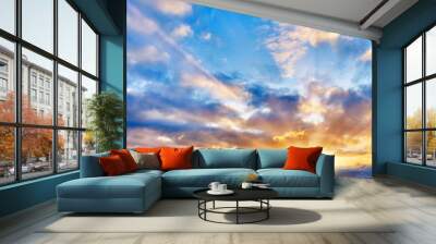 sunset sky landscape background natural color of evening cloudscape with setting sun light coming through clouds wide view Wall mural